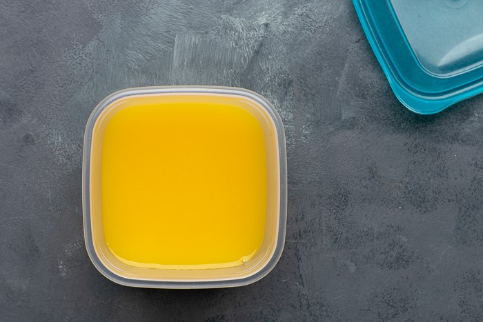 Orange juice in a plastic container