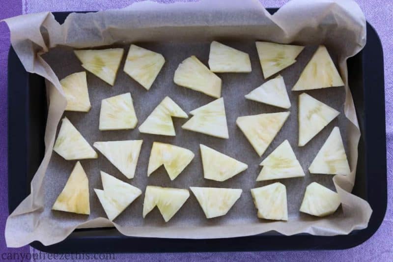 Pineapple chunks on a cookie sheet