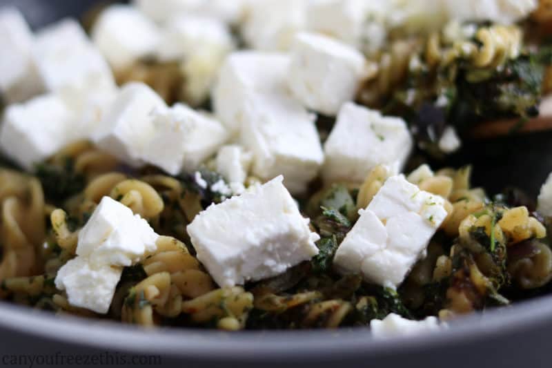 Thawed feta on pasta with spinach